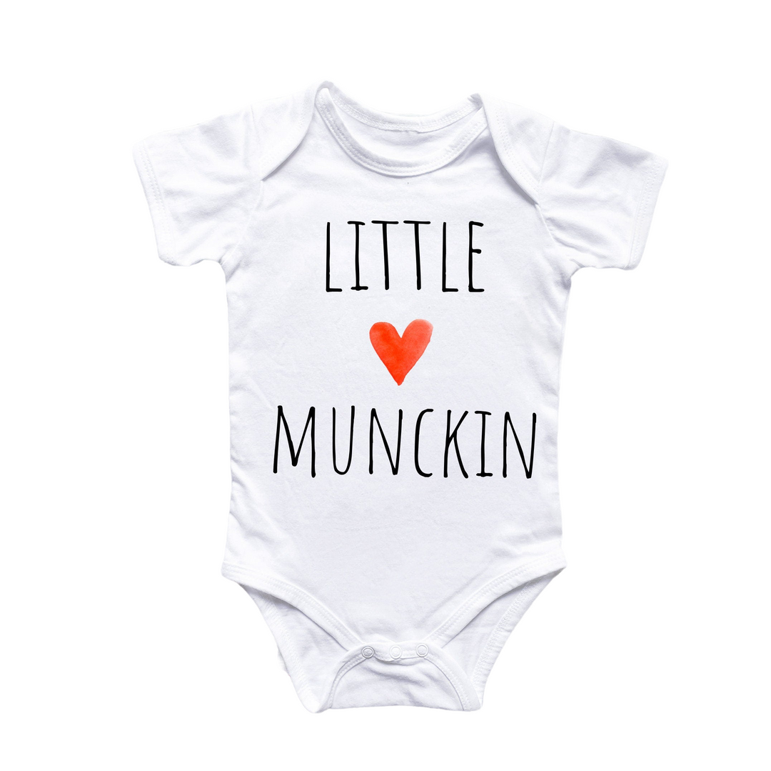 a white bodysuit with a red heart that says little munchin