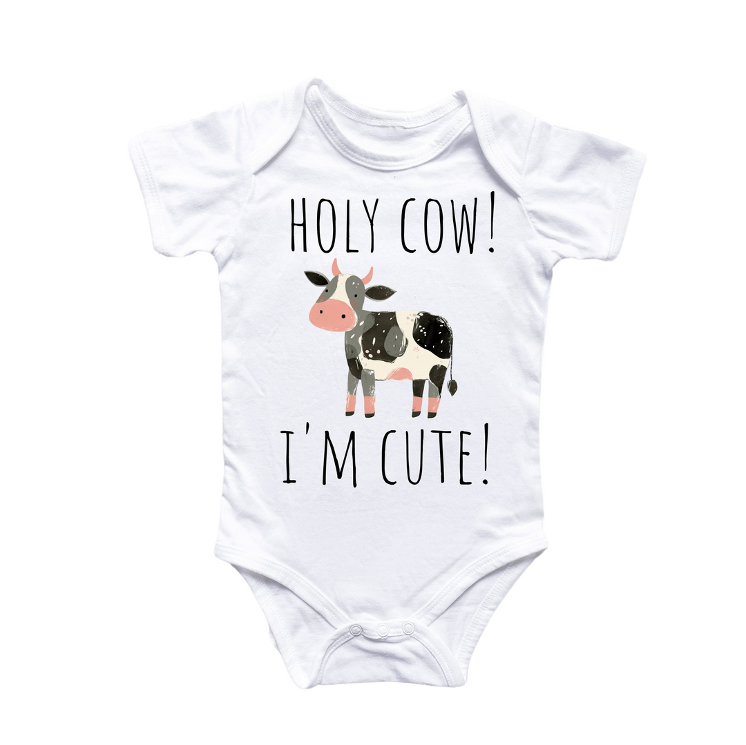 a baby bodysuit with a cow saying, holy cow i'm cute