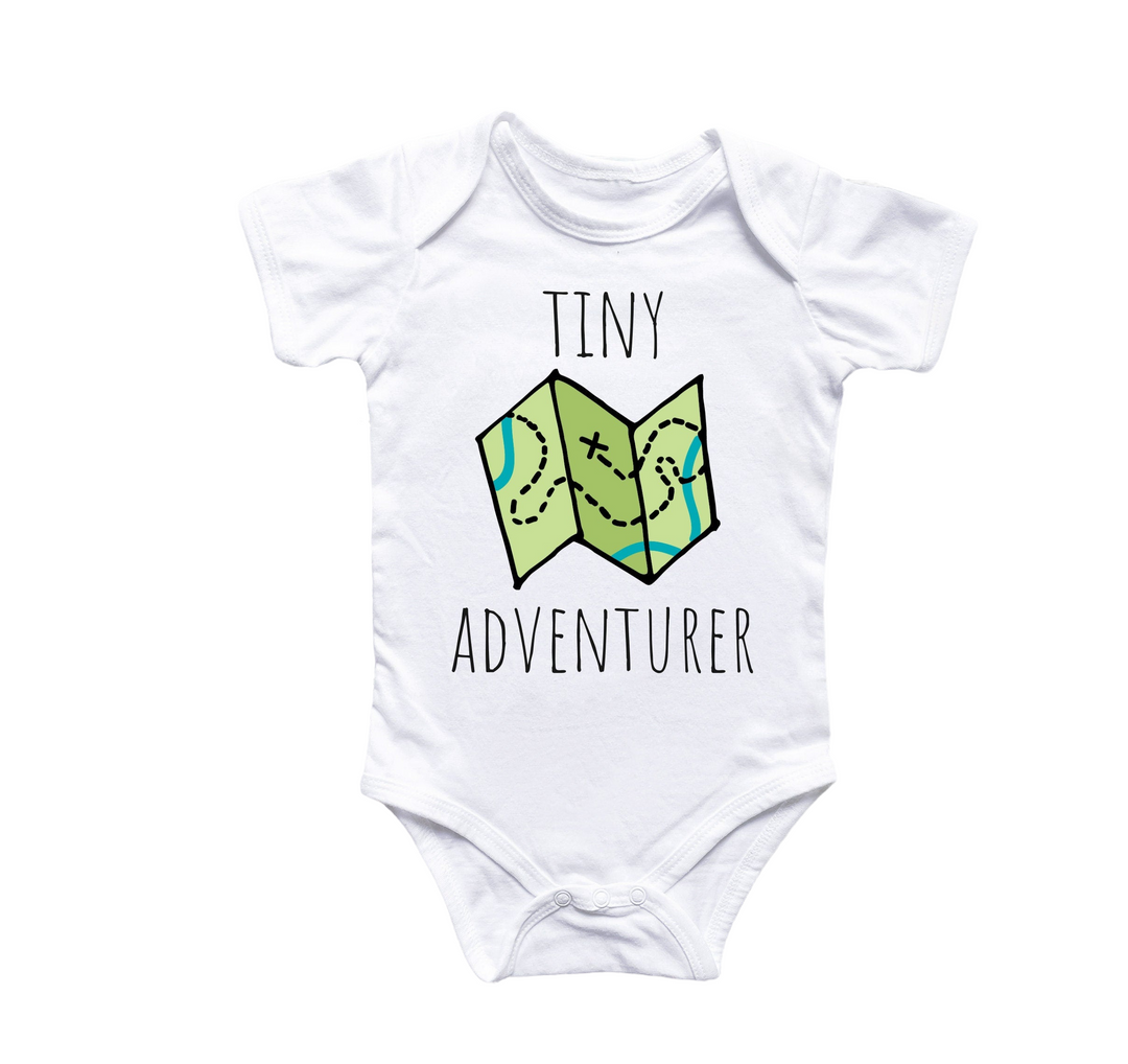 a white bodysuit with a map on it that says tiny adventurer