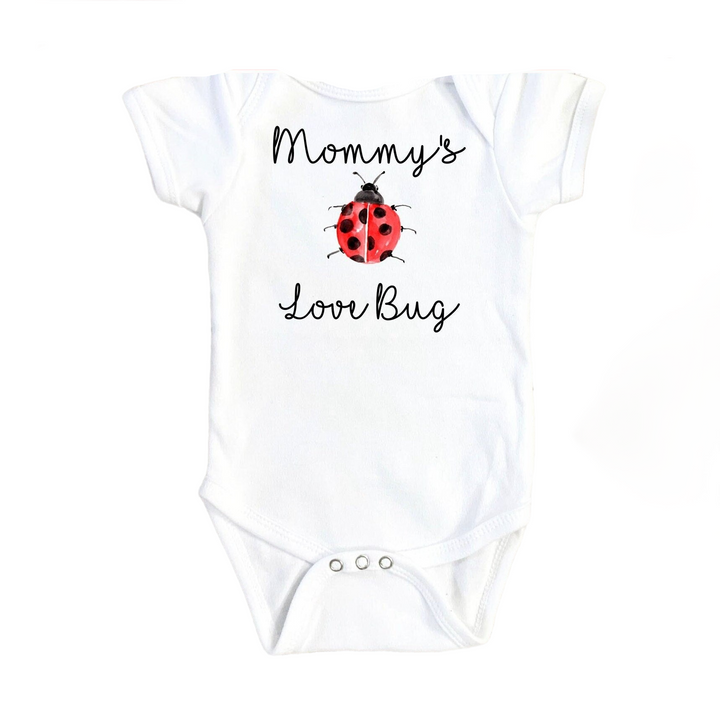 a white baby bodysuit with a ladybug on it