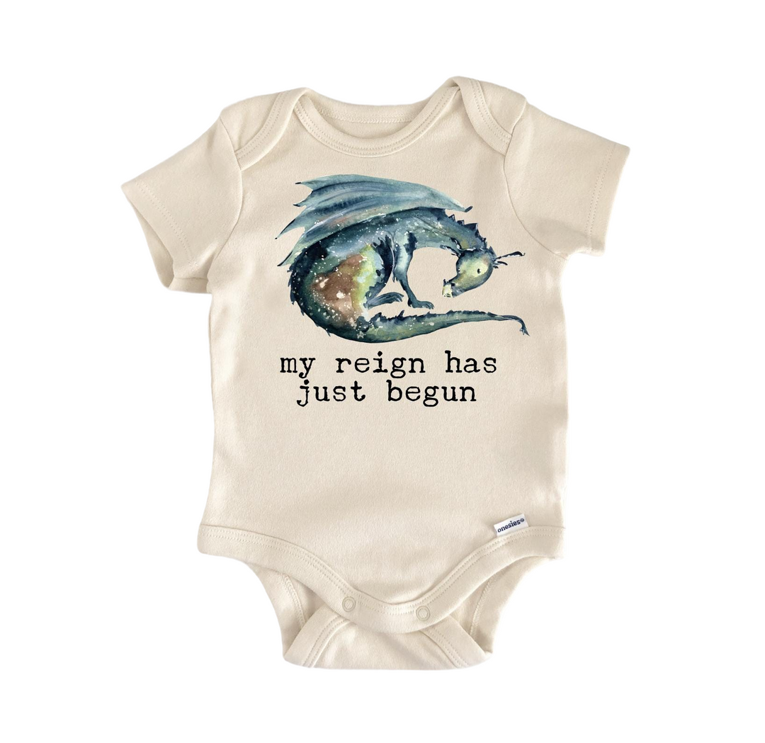 a baby bodysuit with a picture of a dragon on it