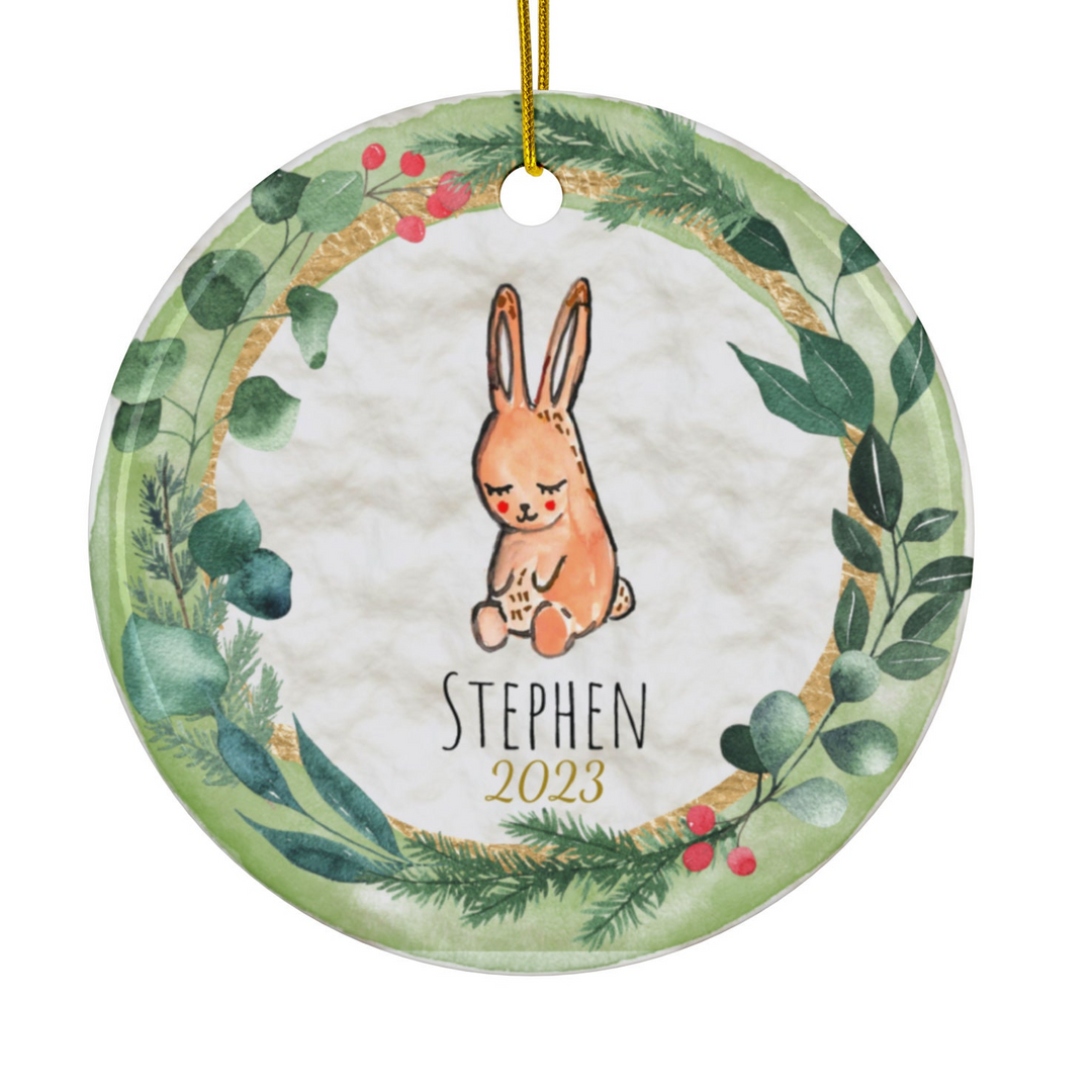 a ceramic ornament with a picture of a rabbit in a wreath