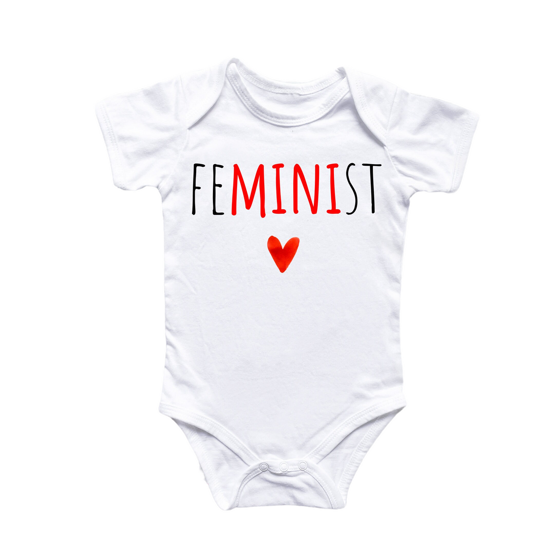 a white bodysuit with the word feminist printed on it