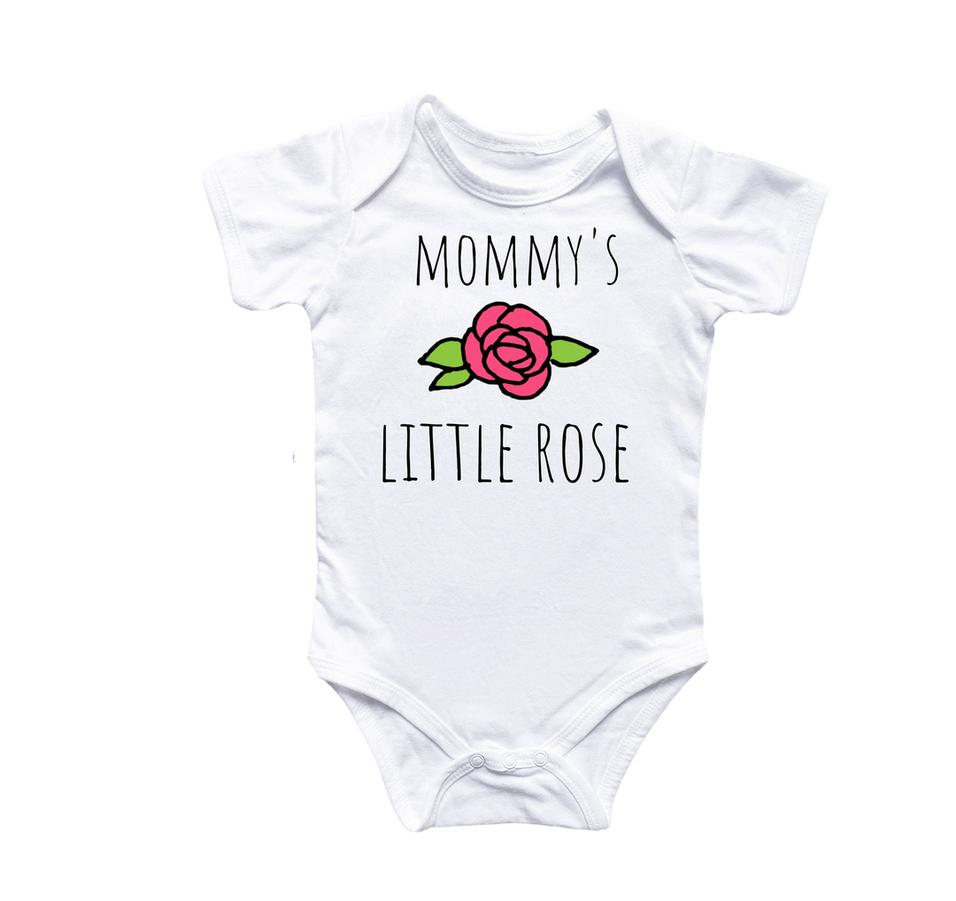 a white baby bodysuit with a pink rose on it