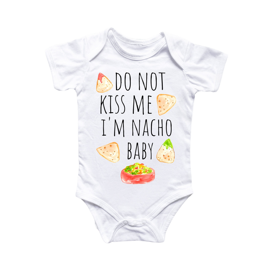 a white bodysuit with a baby saying do not kiss me i'm na