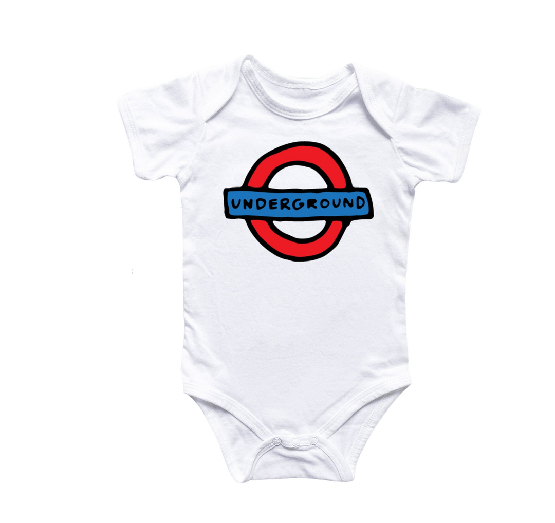 a white bodysuit with a london underground sign on it