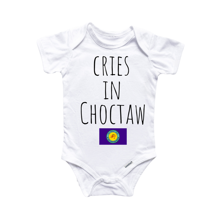 a white onesuit with the words cries in choctaw on it