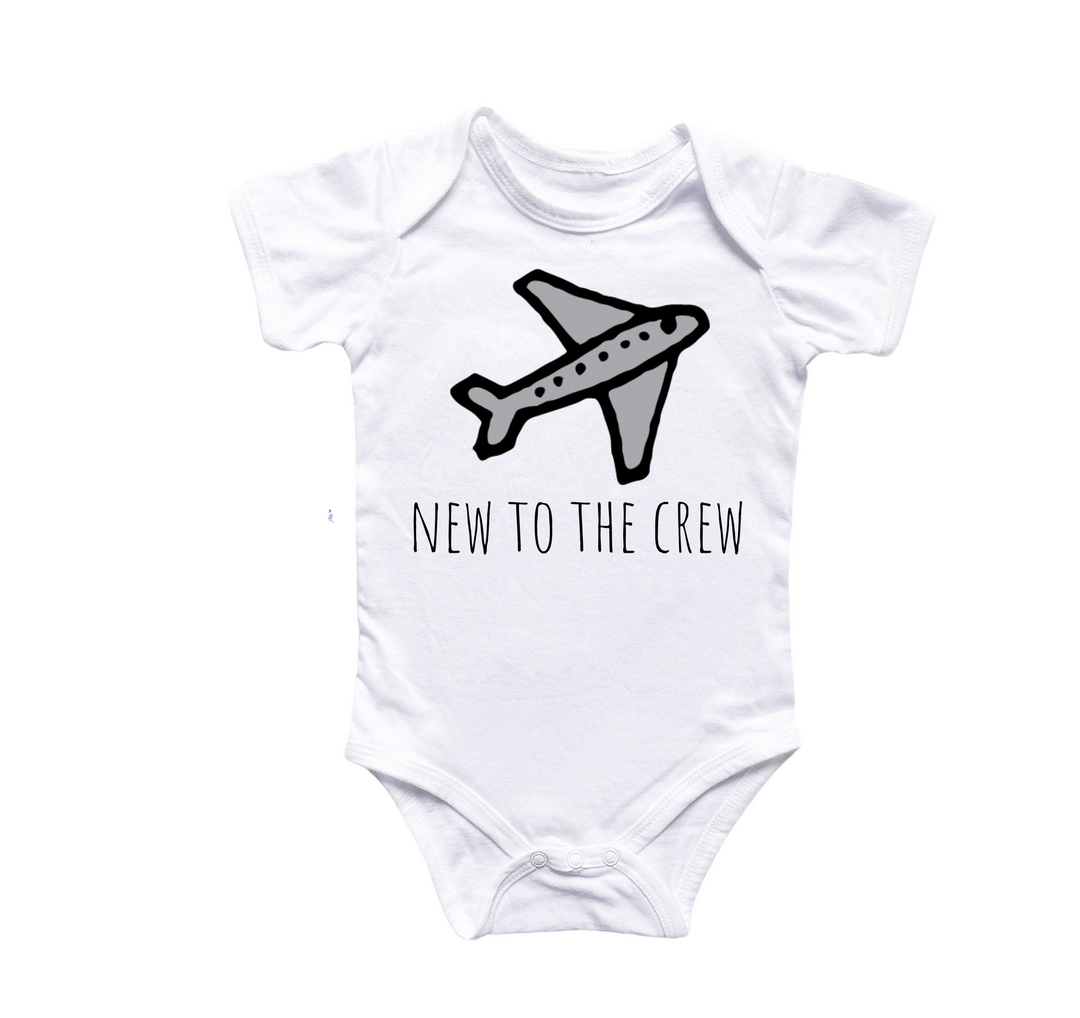 a white bodysuit with a black and white airplane on it