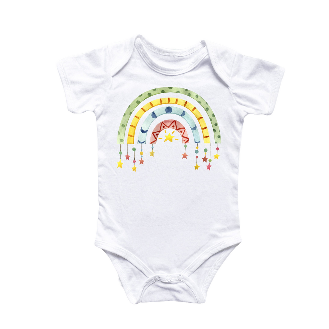 a white bodysuit with a rainbow and stars on it