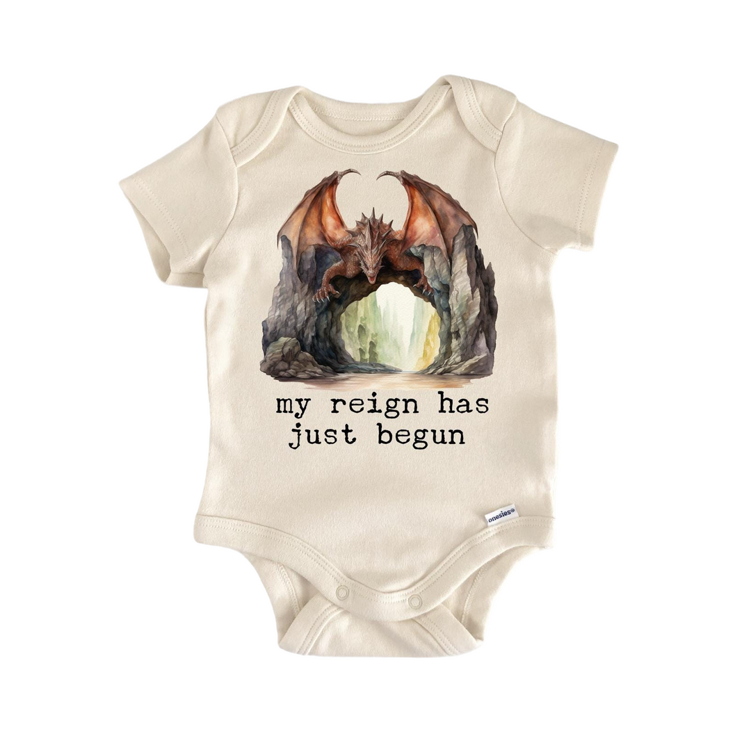 a baby bodysuit with a picture of a dragon on it