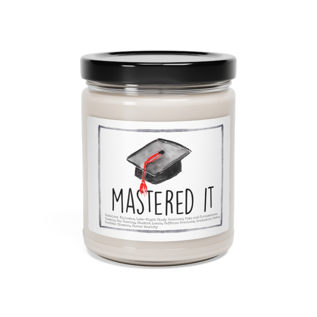 a candle with a graduation cap on it