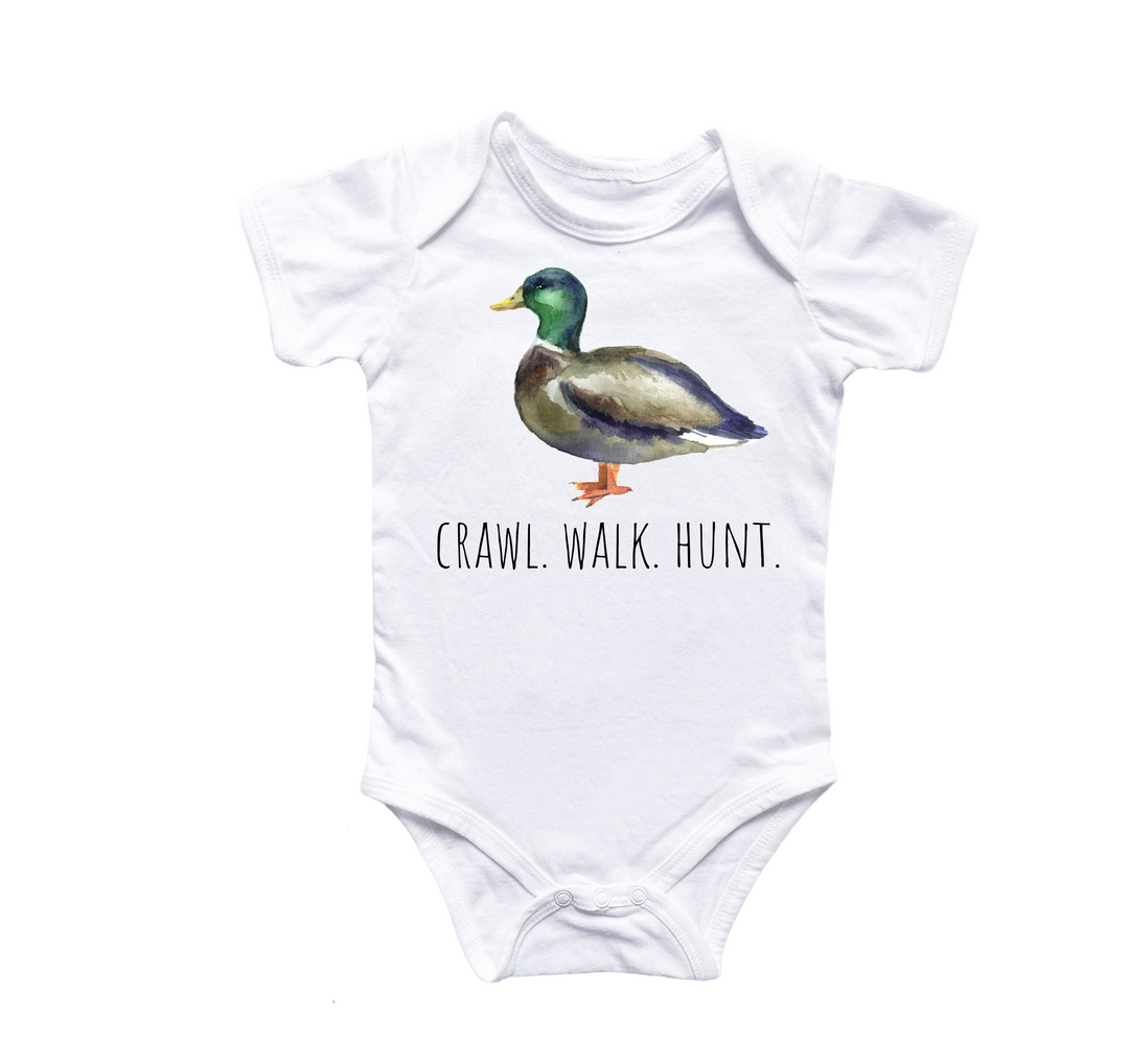 a white bodysuit with a green duck on it