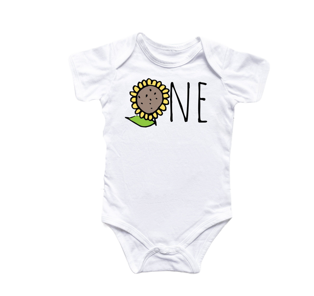 a white onesie with a sunflower on it