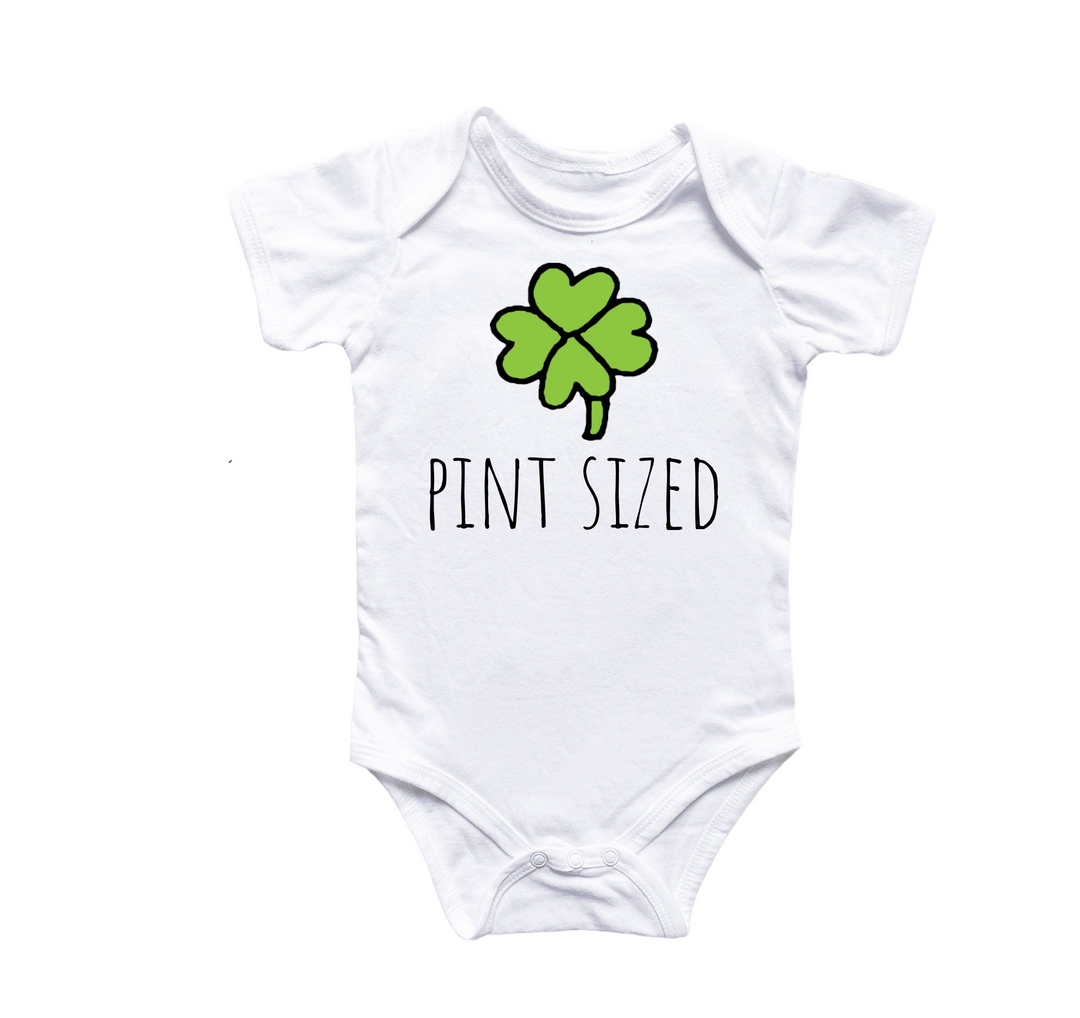 a white bodysuit with a four leaf clover that says pint sized