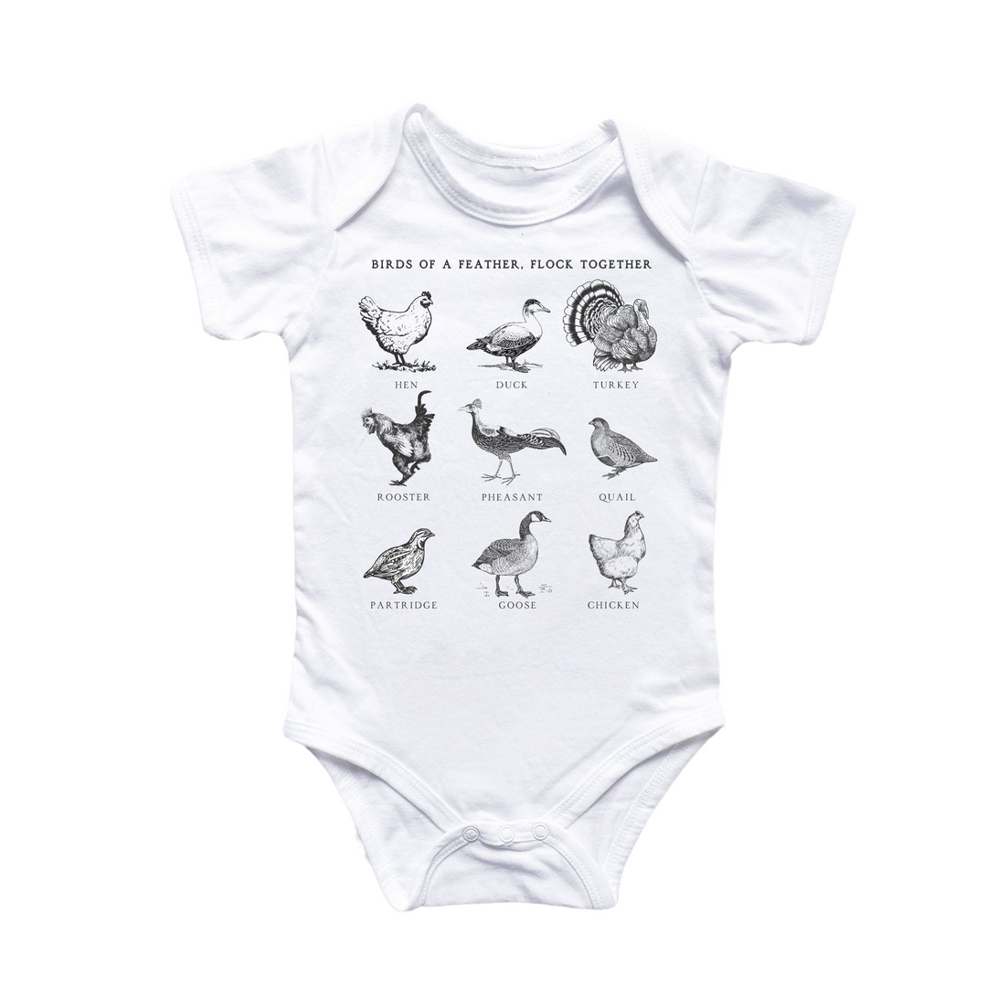 a white bodysuit with a bunch of birds on it