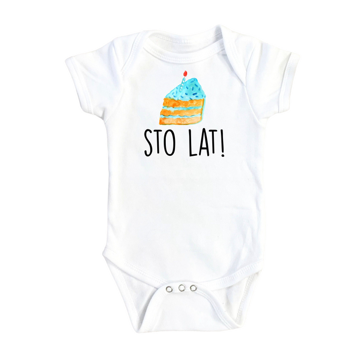 a white baby bodysuit with a cake on it