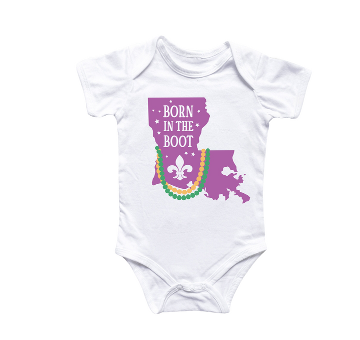 a white bodysuit with the words born in the boot on it