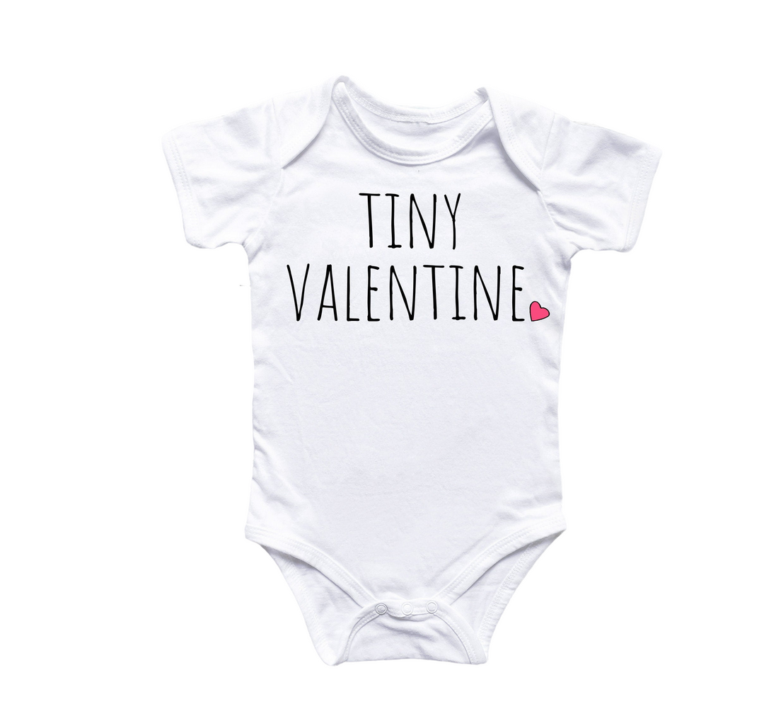 a white bodysuit with tiny valentine written on it