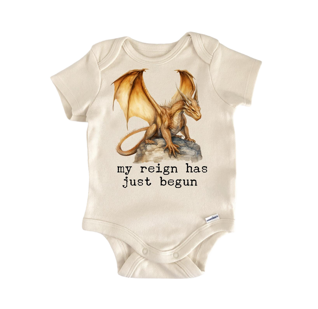 a baby bodysuit with a picture of a dragon on it