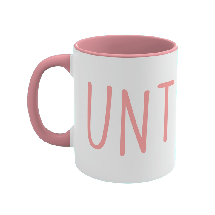 a pink and white coffee mug with the word unit printed on it