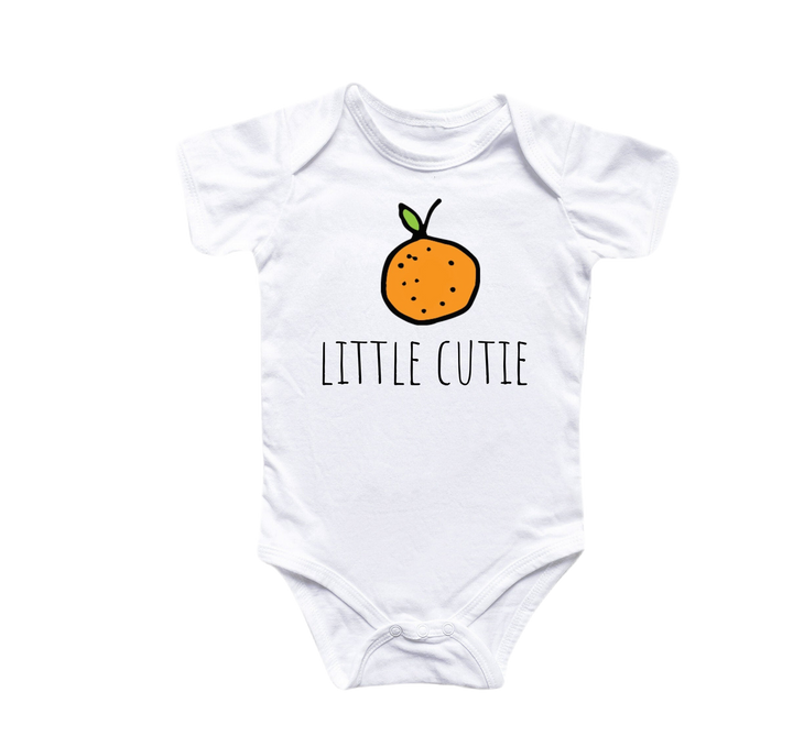 a white bodysuit with a picture of a orange and the words little cutie