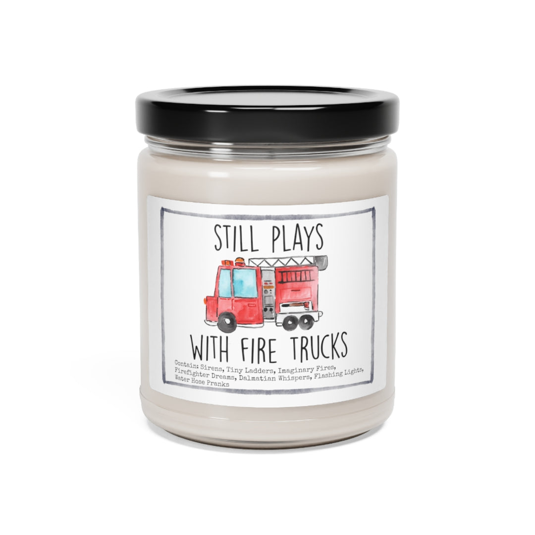 a candle with a picture of a fire truck on it