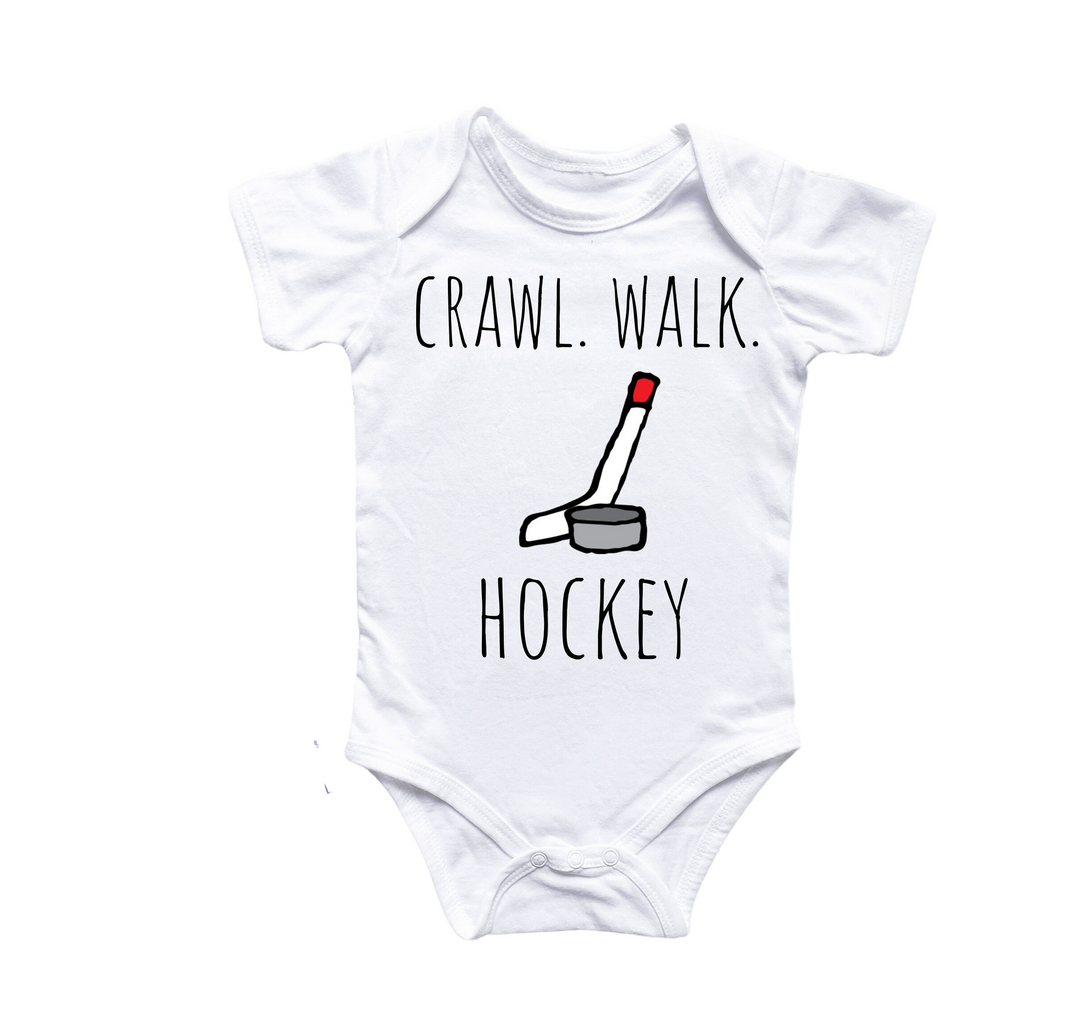 a baby bodysuit that says crawl walk hockey