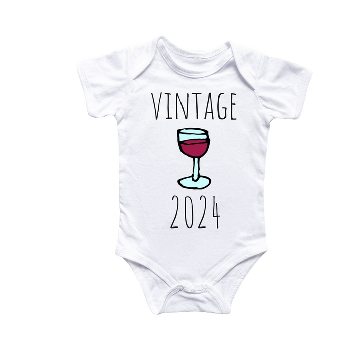 a baby bodysuit with a glass of wine on it