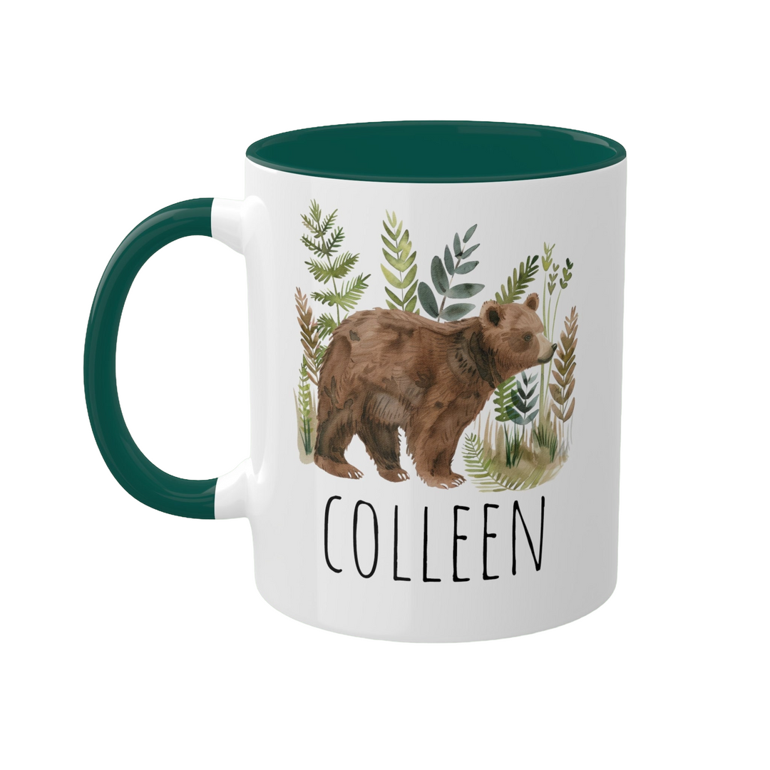 a green and white coffee mug with a brown bear