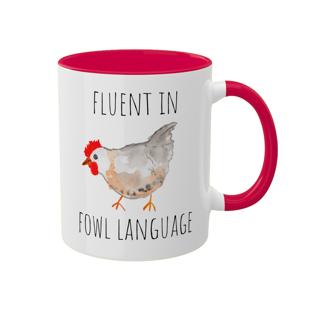 a red and white coffee mug with a chicken on it