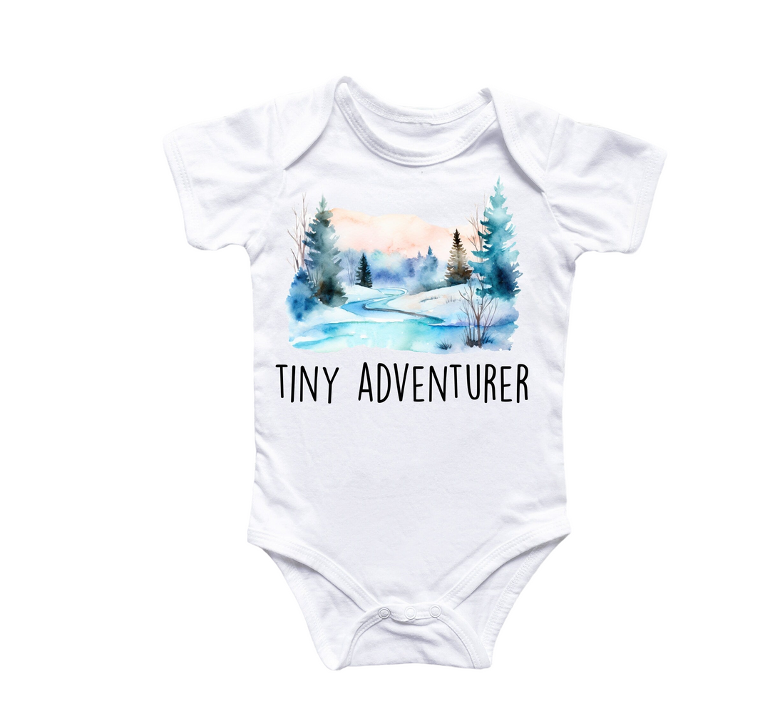 a white bodysuit with the words tiny adventurer printed on it