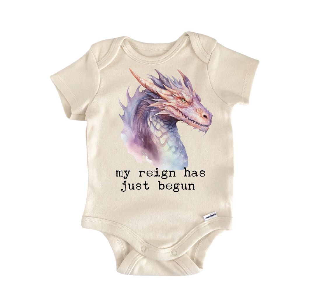 a baby bodysuit with a picture of a dragon on it