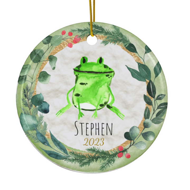 a green ornament with a picture of a frog on it