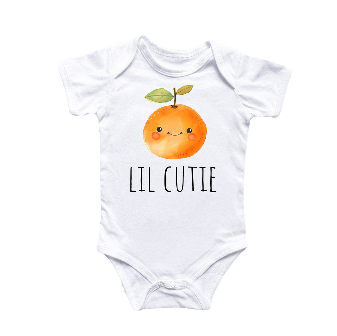 a white bodysuit with an orange on it that says lil cutie