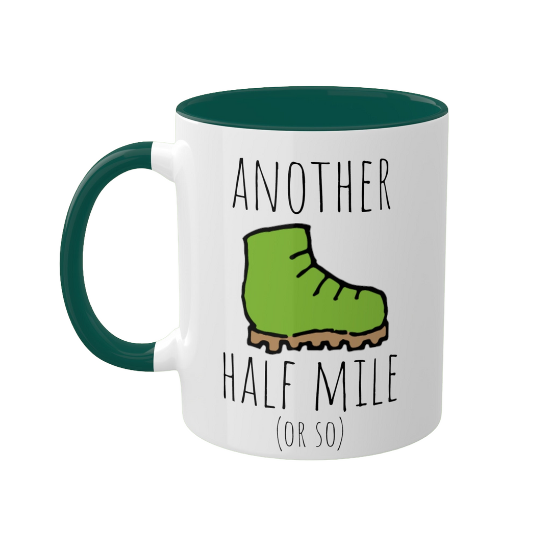 a green and white coffee mug with a green boot on it