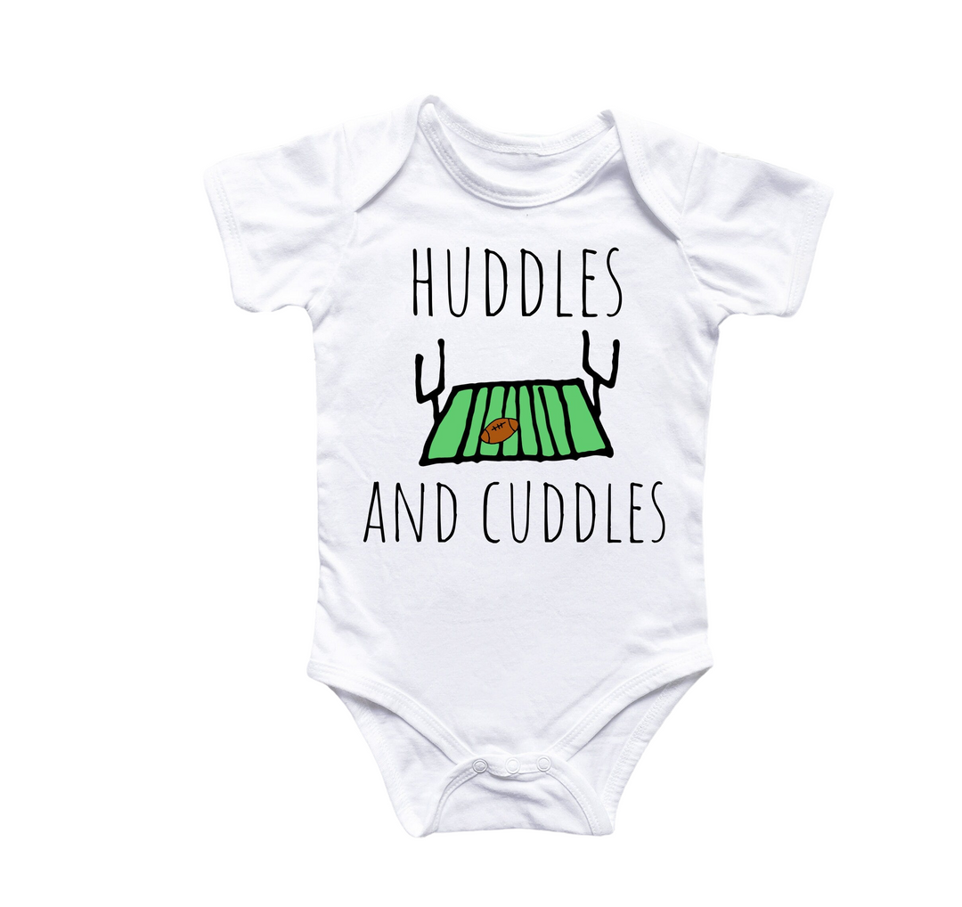 a white baby bodysuit with the words huddles and cuddles on