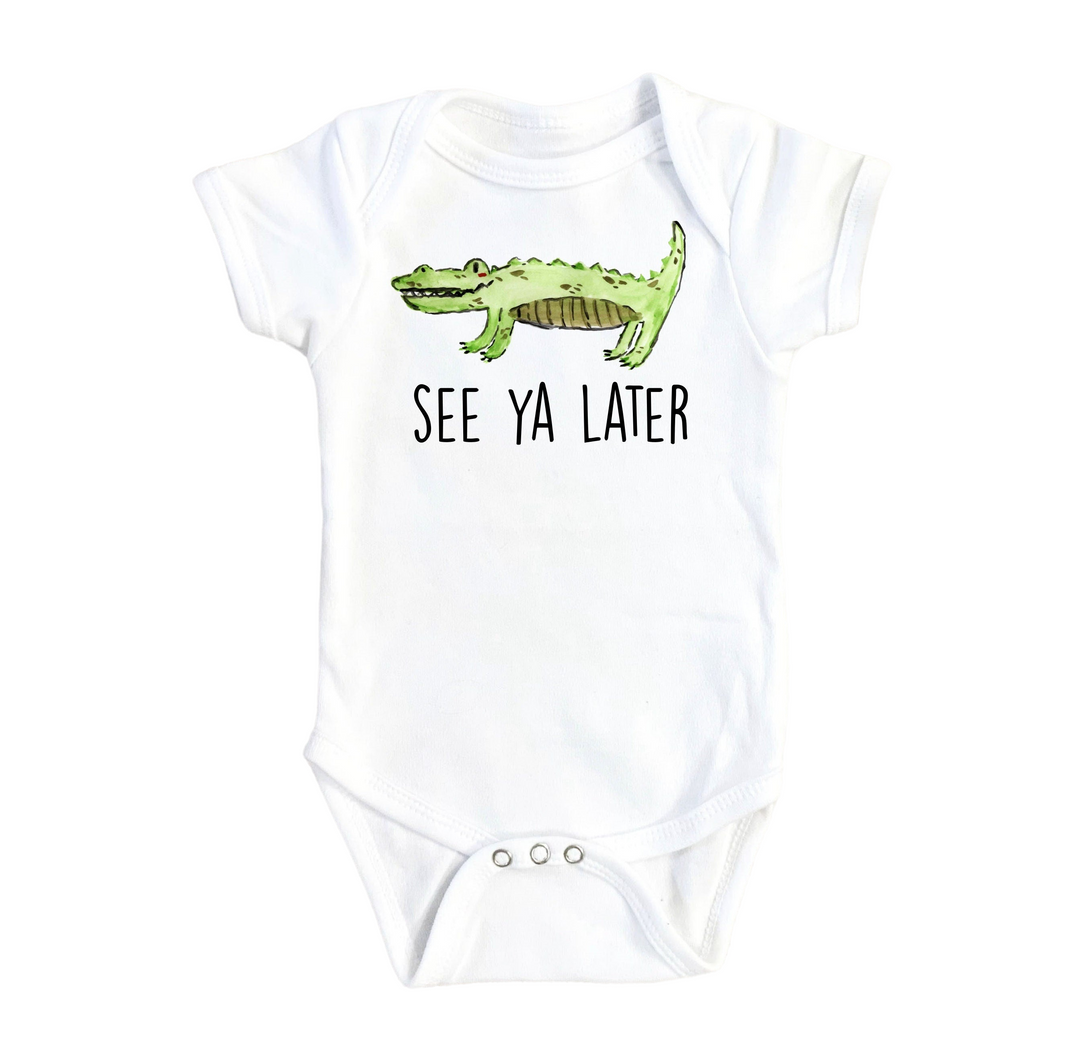 a white bodysuit with a green alligator on it