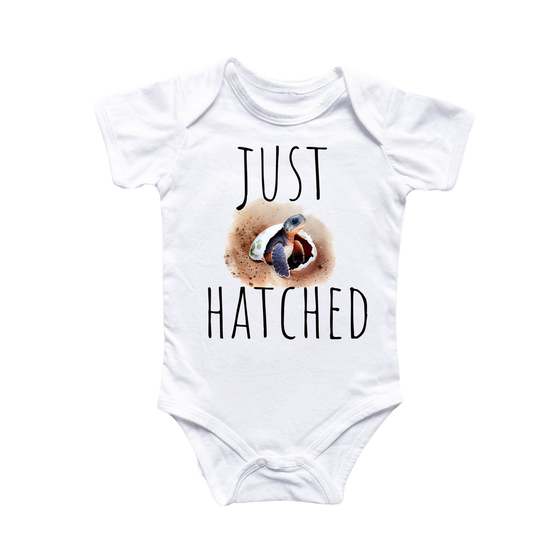 a baby bodysuit with a picture of a bird on it