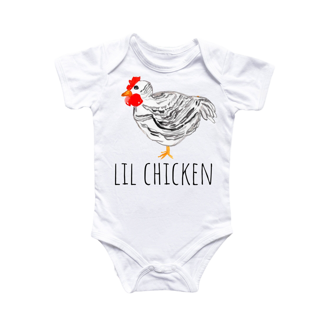 a white bodysuit with a chicken on it