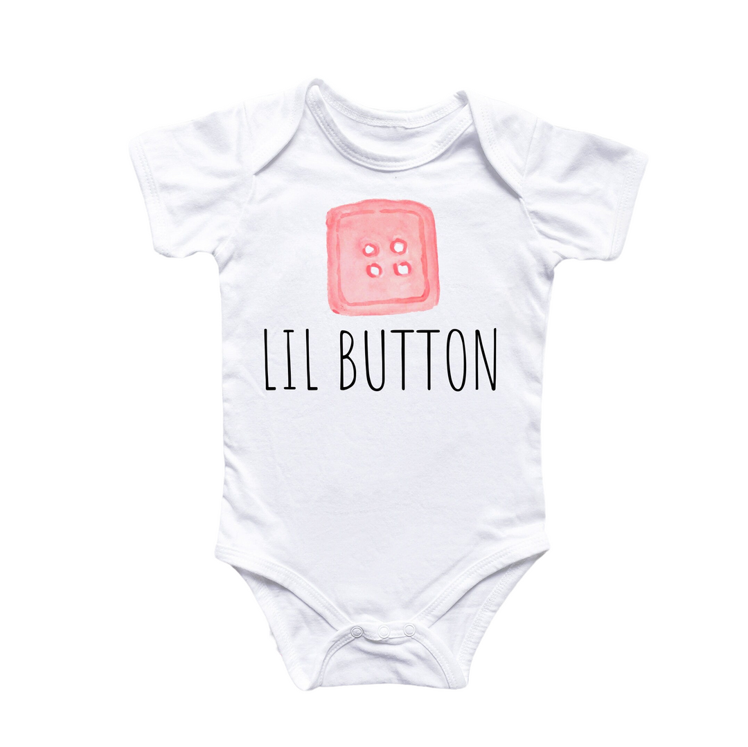 a white bodysuit with the words lil button on it