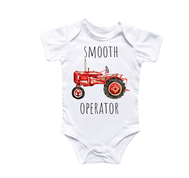 a white bodysuit with a red tractor on it