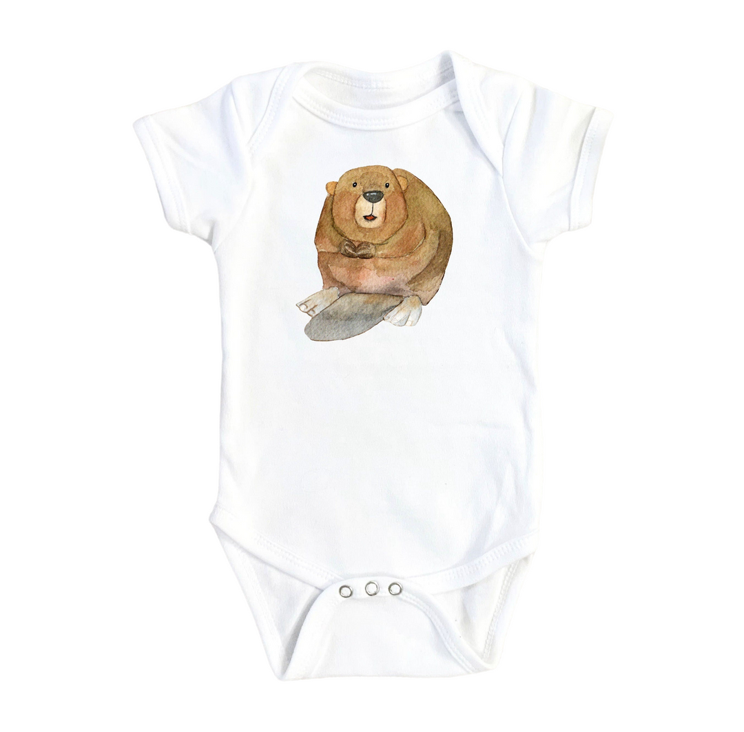 a white bodysuit with a brown bear on it