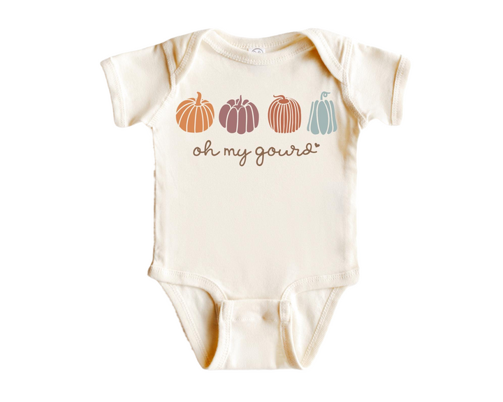 a baby bodysuit with pumpkins on it