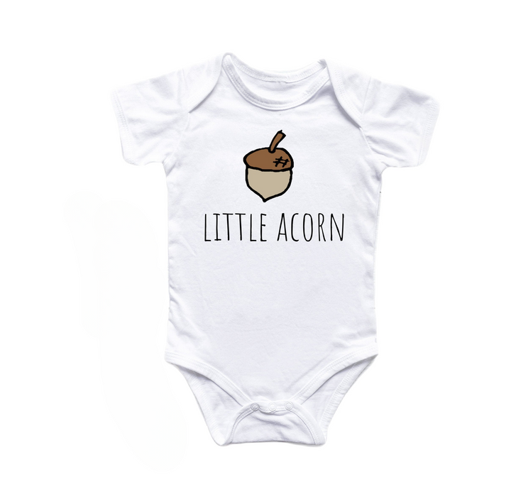 a white baby bodysuit with the words little acorn on it