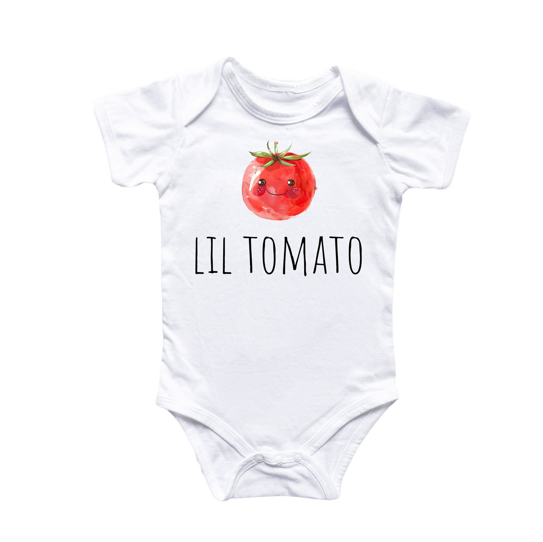 a white bodysuit with a tomato on it