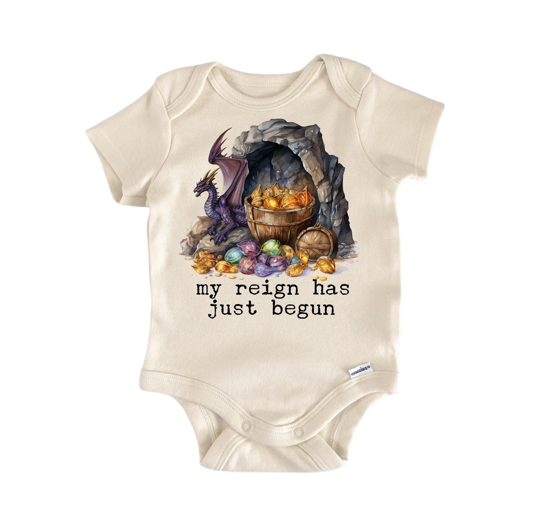 a baby bodysuit with an image of a dragon and a barrel of gold