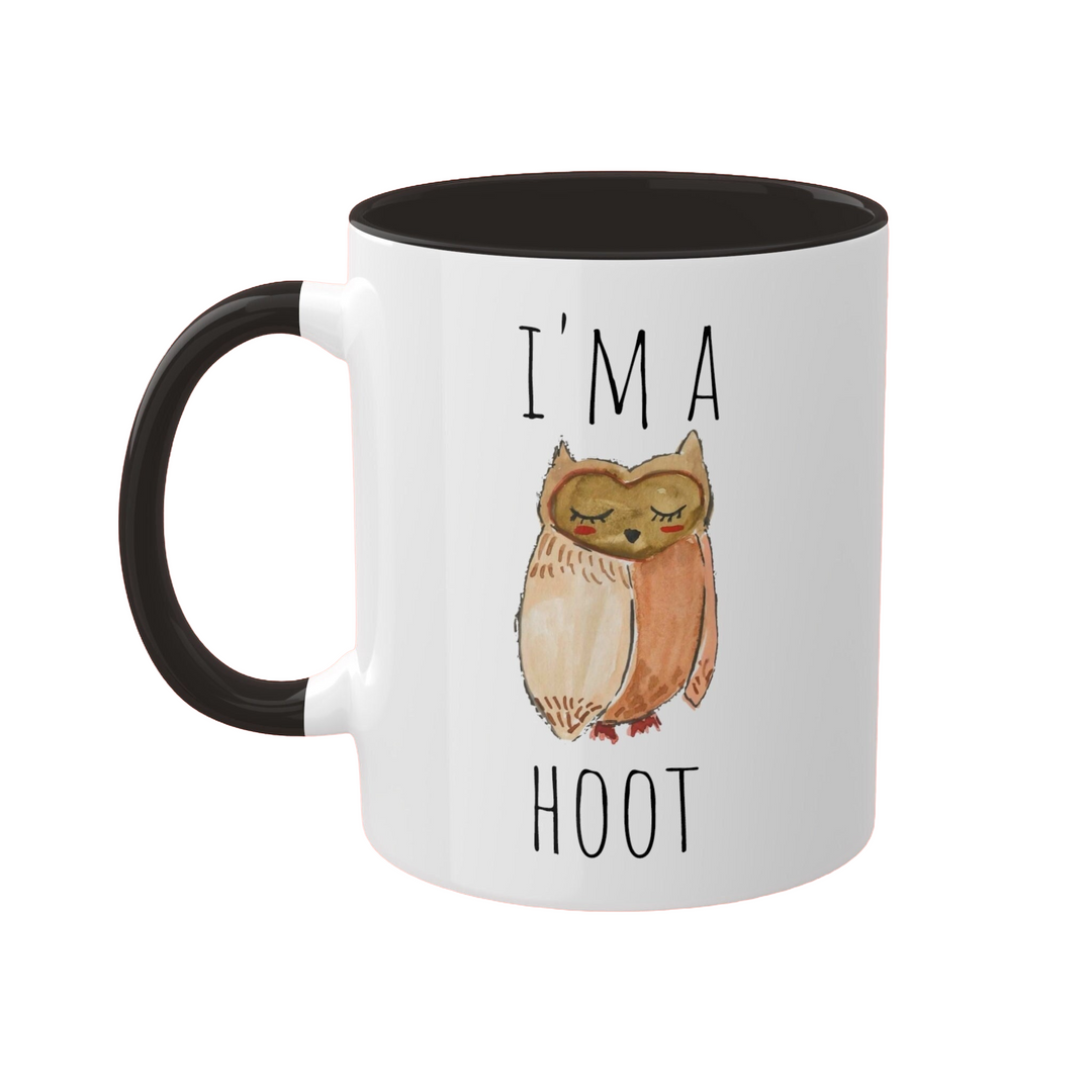 a white and black coffee mug with an owl on it