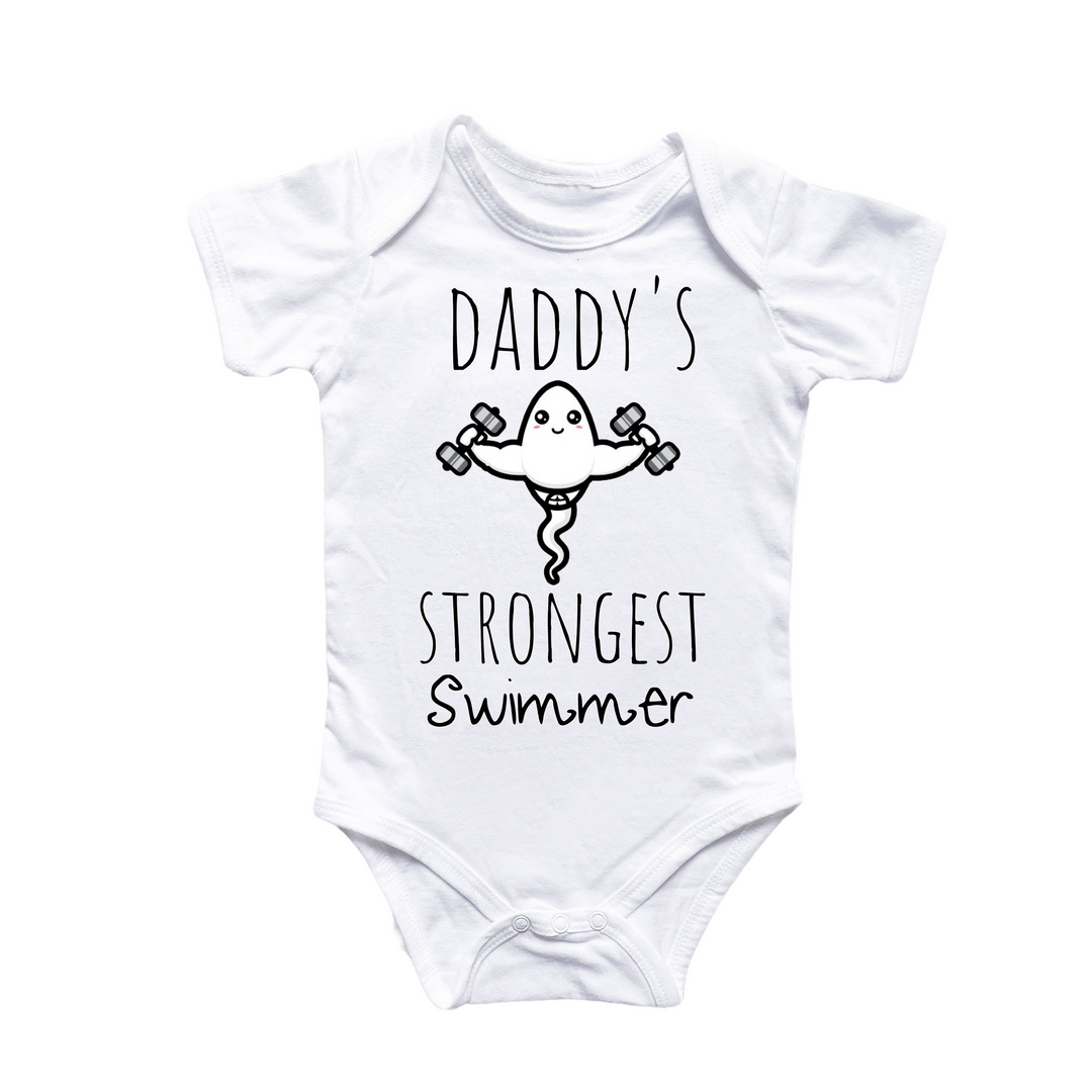 a baby bodysuit that says daddy's strongest swimmer