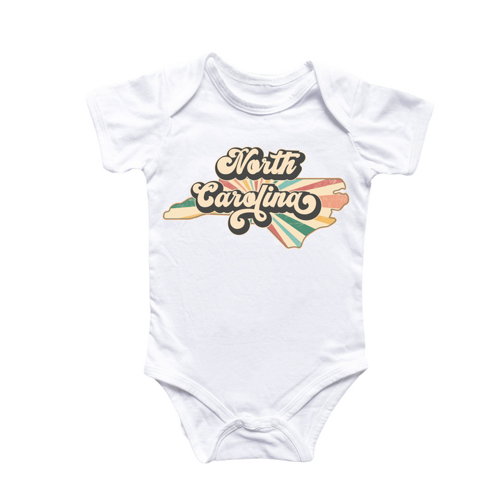 a white bodysuit with a surfboard design on it