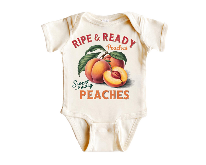 a baby bodysuit with peaches on it